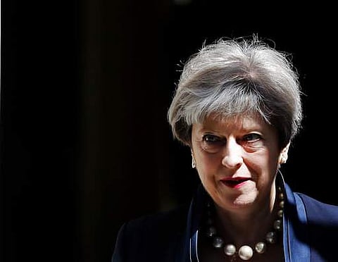 Britain's Prime Minister Theresa May leaves 10 Downing Street to attend Prime Ministers Questions at the House of Parliament in London, Wednesday, July 5, 2017.(AP Photo/Frank Augstein)