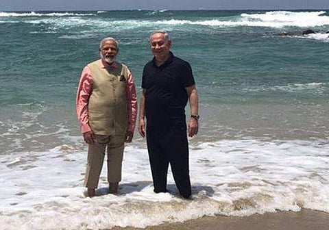 PM Narendra Modi and Israel PM Benjamin Benjamin Netanyahu at the Dor beach in Israel on July 6. (Cropped photo from Facebook account of Netanyahu)