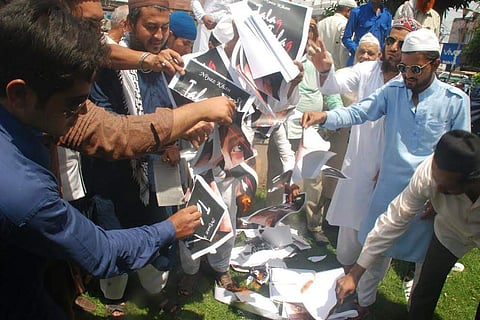 Protesters burning the copies of Talaq Talaq Talaq by Niyaz Khan in Bhopal. | EPS