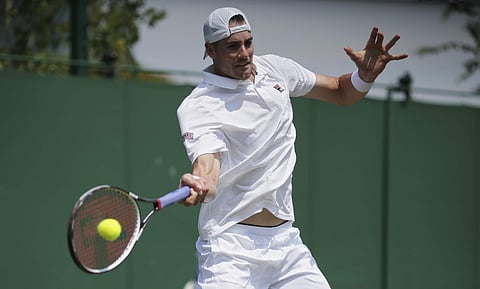 John Isner of the United States returns to Israel's Dudi Sela during their Men's Singles Match on day four at the Wimbledon Tennis Championships in London Thursday, July 6, 2017. | AP