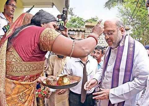 BJP president Amit Shah being greeted at Basantpur village on the outskirts of Bhubaneswar during the party’s booth connect programme on Thursday | shamim