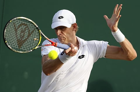 South Africa's Kevin Anderson returns to Belgium's Ruben Bemelmans during their Men's Singles Match on day five at the Wimbledon Tennis Championships in London Friday, July 7, 2017.(AP)