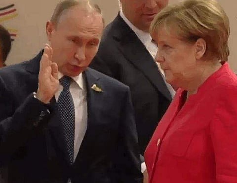 Russian President Vladimir Putin and German Chancellor Angela Merkel. (Photo | Twitter)