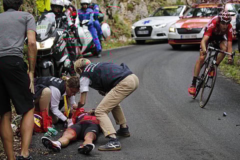 Australia's Richie Porte gets medical assistance after crashing in the descent of the Mont du Chat pass during the ninth stage of Tour de France. | AP