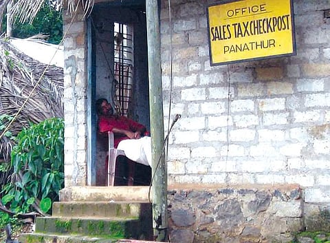 A Sales Tax official snoozes at the Panathur check post in Kasargod