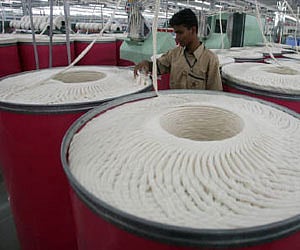 An employee works inside a textile mill in Jhagadia village in Gujarat. (File photo | Reuters)