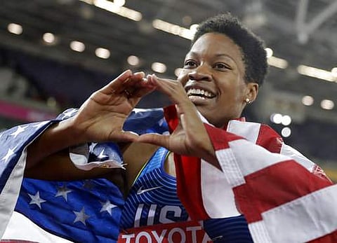 Phyllis Francis celebrates after winning the gold medal in the women's 400-meter final during the World Athletics Championships in London. | AP