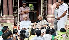 Gandhian Ayyappan Pillai and poet Sugathakumari with the students who visited the former at his residence at Thycaud on Wednesday.