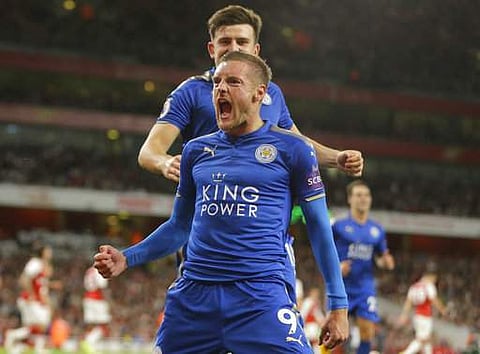 Leicester City's Jamie Vardy, centre celebrates with teammates after scoring his sides third goal of the game during their EPL match against Arsenal at the Emirates stadium in London. | AP
