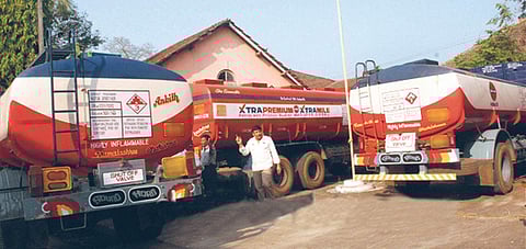 Fuel tankers parked along a highway