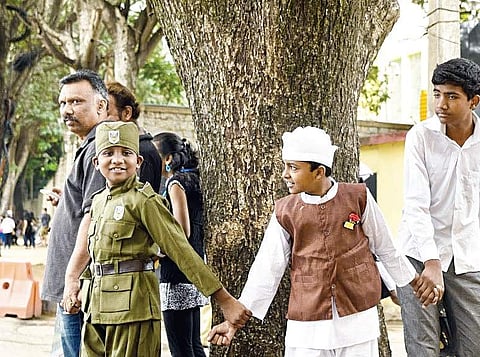 Residents of Vinayakanagar and KR Gardens in Bengaluru formed a half-a-kilometre-long human chain on Sunday morning to protest the axing of trees on Old Airport Road | Express