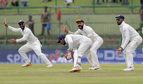 India's captain Virat Kohli, second right, and teammates appeal unsuccessfully for the wicket of a Sri Lankan batsman during the third day's play of their third cricket test match in Pallekele. (Photo | AP)