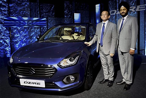Kenichi Ayukawa, Managing Director CEO of Maruti Suzuki and R S Kalsi, Executive Director, Marketing Sales, Maruti Suzuki at the launch of the new Maruti Suzuki Dzire car during a press conference in New Delhi on Tuesday. | PTI Photo