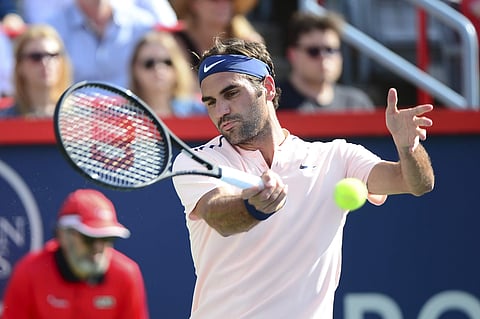 Roger Federer, of Switzerland, hits to Alexander Zverev, of Germany, during the final of the Rogers Cup tennis tournament. | AP
