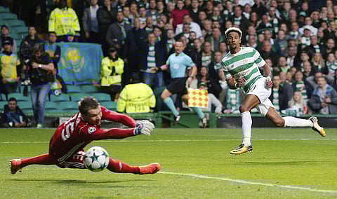 Celtic's Scott Sinclair scores his side's second goal of the game against Astana during their Champions League Play-Off, First Leg soccer match at Celtic Park. | AP