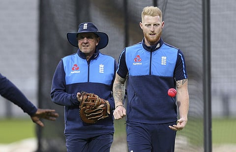 England's coach Trevor Bayliss and Ben Stokes, right, plays with a pink ball during a training session ahead of the day-night Test. | AP
