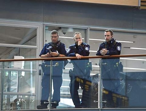 Armed Finnish policemen on guard at the Helsinki airport on Friday, Aug. 18, 2017, as Finnish authorities announced they will raise readiness levels after an incident in Turku Finland. Police in Finland say they have shot a man in the leg after he was sus