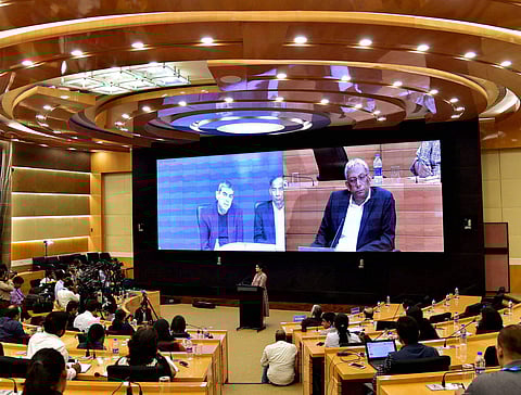 Infosys Executive Vice Chairman Former CEO Vishal Sikka addressing through a video-link from California as Co-Chairman Ravi Venkatesan looks on during a press conference to announce the new interim CEO at the company's headquarters in Bengaluru on Friday.
