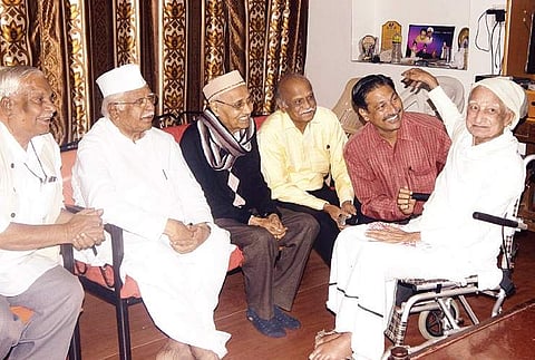 Poet Chennaveera Kanavi and late scholar M M Kalburgi with Enagi Balappa (right)