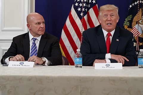 National Security Adviser H.R. McMaster listens as President Donald Trump speaks to reporters after a security briefing | AP