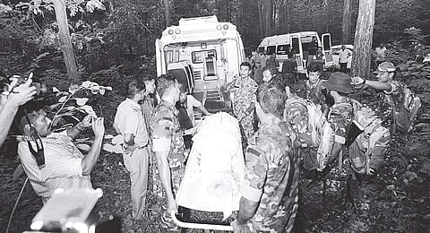 Security personnel carry the bodies of Maoists Kuppu Devaraj and Ajitha at Karulai in Malappuram (File | EPS)