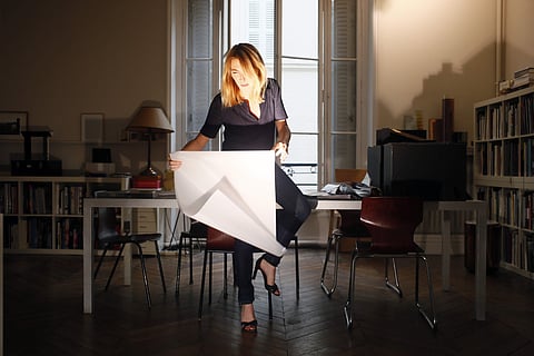 French lighting designer Odile Soudant poses in her studio in Paris, Friday Aug. 18, 2017 | AP