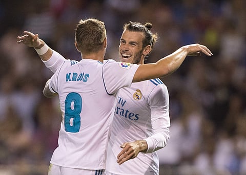 Real Madrid's Toni Kroos, left, is congratulated by Real Madrid's Gareth Bale after scoring a goal during the Spanish La Liga match between Deportivo and Real Madrid. | AP