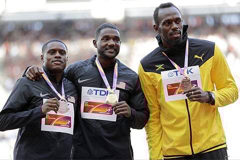 United States' Christian Coleman, silver, Justin Gatlin of the United States, gold, and Jamaica's Usain Bolt, bronze, from left, during the medal ceremony for the Men's 100m during the World Athletics Championships in London. | AP