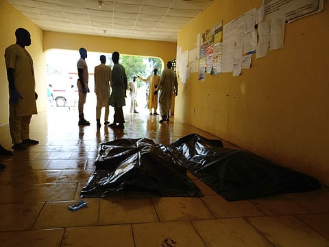 mily members wait to claim bodies of suicide attack victims at a hospital in Konduga outside Maiduguri (File | AP)