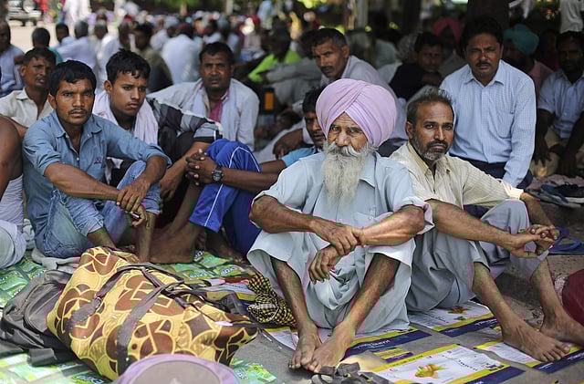 Followers of Gurmeet Ram Rahim Singh, the controversial head of religious sect Dera Sacha Sauda (DSS), gather on the roadside in Sirsa, where his organization is based, on August 24, 2017, ahead of the verdict in the rape case against Gurmeet Ram Rahim. (Photo | PTI)