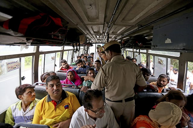 Indian policemen stop a vehicle to check for supporters of the Dera Sacha Sauda sect near Panchkula, India, Thursday, Aug. 24, 2017. Vehicles entering Haryana state are being searched, where both the court house and the guru's ashram are located, and people carrying food and bedding (in order to join the courthouse crowds) are being turned away. (Photo | AP)
