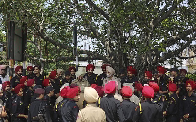 A police officer briefing commandos of the Punjab Police near the Panchkula court in Chandigarh.  (Photo | AP)
