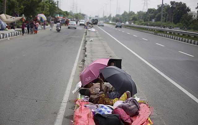 Followers of Gurmeet Ram Rahim Singh, the controversial head of religious sect Dera Sacha Sauda (DSS), gather on the roadside in Sirsa, where his organization is based, on August 24, 2017, ahead of the verdict in the rape case against Gurmeet Ram Rahim. (Photo | AP)