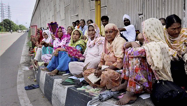 Followers of Gurmeet Ram Rahim Singh, the controversial head of religious sect Dera Sacha Sauda (DSS), gather on the roadside in Sirsa, where his organization is based, on August 24, 2017, ahead of the verdict in the rape case against Gurmeet Ram Rahim. (Photo | AP)