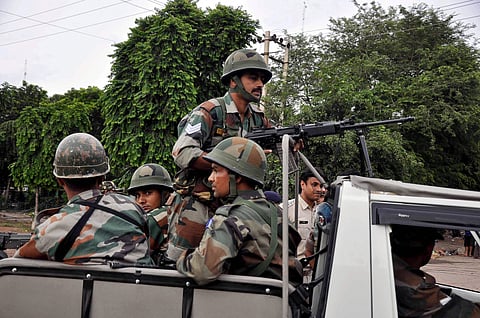 Army personnel patrol a street ahead of the verdict on Dera Sacha Sauda chief Gurmeet Ram Rahim in Panchkula on Friday. (PTI)
