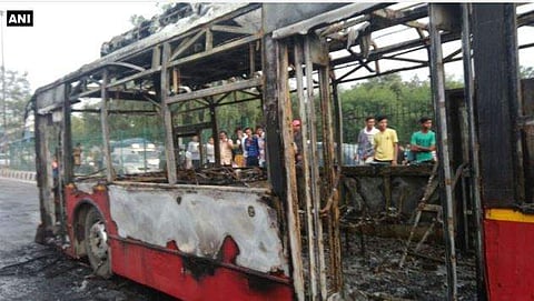 Bus torched by followers of Dera Sacha Sauda in northeast Delhi's Loni Chowk. (Photo| Twitter ANI)