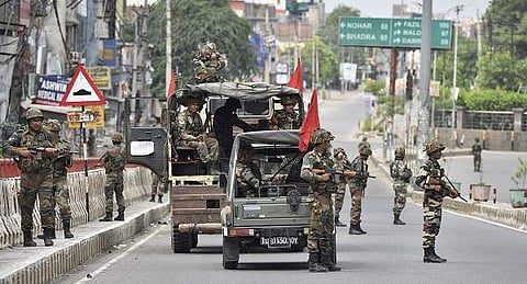 Sirsa Army jawans conduct a flag march amidst curfew after their deployment near Dera Sacha Sauda in Sirsa on Saturday. (Photo | PTI)