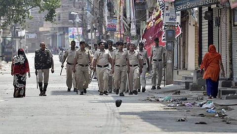 Policemen march amidst curfew in Sirsa on Saturday. | PTI