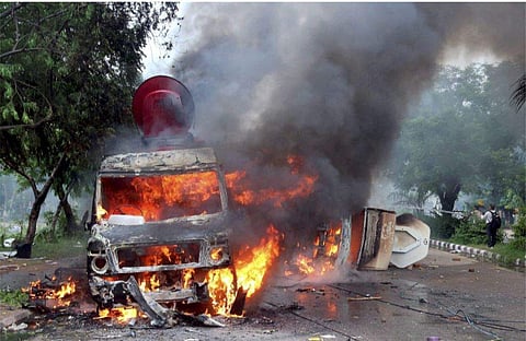 Media vans torched by angry Dera Sacha Sauda followers, following Dera chief Gurmeet Ram Rahim Singh being convicted for rape yesterday. (Photo | PTI)