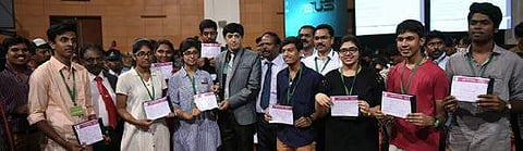 Health Secretary J Radhakrishnan and the top rankers with their medical seat allotment  orders, during the first day of medical counselling.| Express