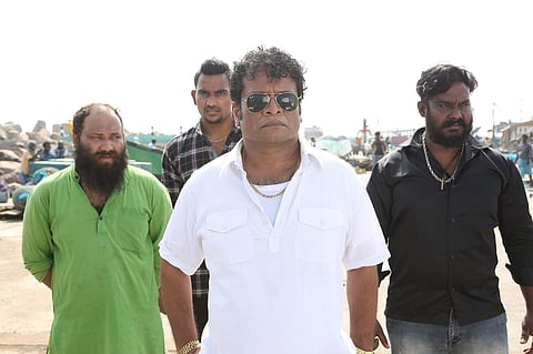 Hareesh Peradi (centre) in a still from 'Viikram Vedha'.