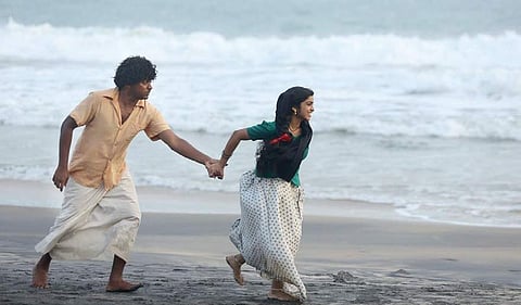Asif Ali and Manasa in a still from Arun Kumar Aravind's Kaattu.