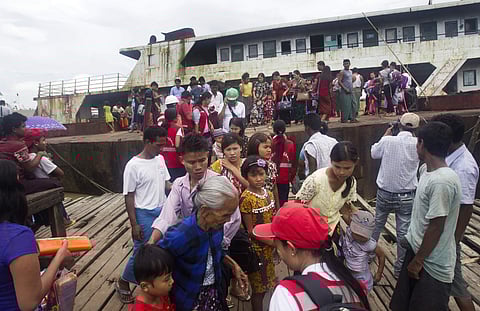 Fleeing Buddhist Rakhine residents arrive by ship from the unrest in Maungdaw at Sittwe jetty Tuesday, Aug. 29, 2017, in Sittwe, Rakhine State, western Myanmar. Recent violence in Myanmar's western Rakhine State has driven thousands of Muslim ethnic Rohin