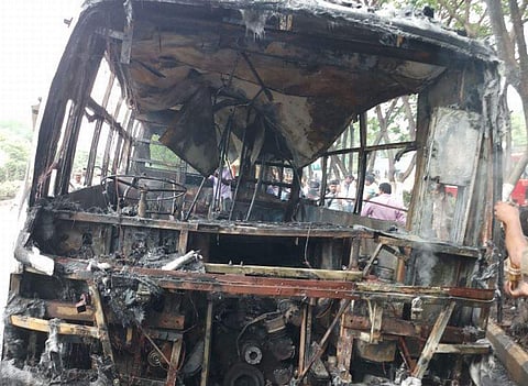 The gutted CNG bus near NTR University in Vijayawada on Tuesday. (EPS)