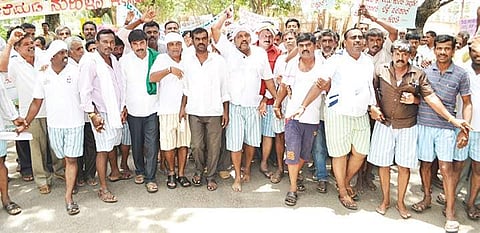 Farmers taking out a protest march in Mandya city on Wednesday
