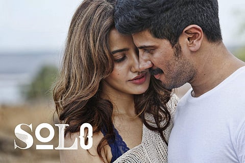 Dulquer Salmaan and Neha Sharma in a still from 'Solo'.