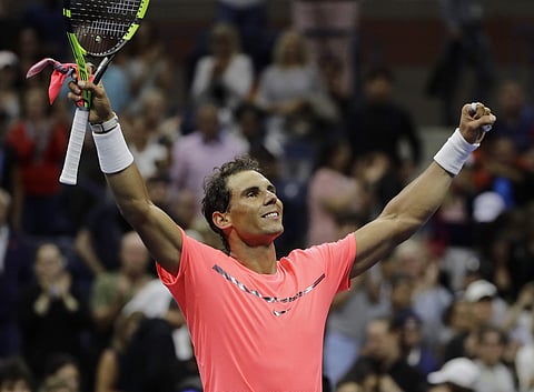 Rafael Nadal, of Spain, celebrates after defeating Dusan Lajovic, of Serbia, during the first round of the US Open tennis tournament. | AP