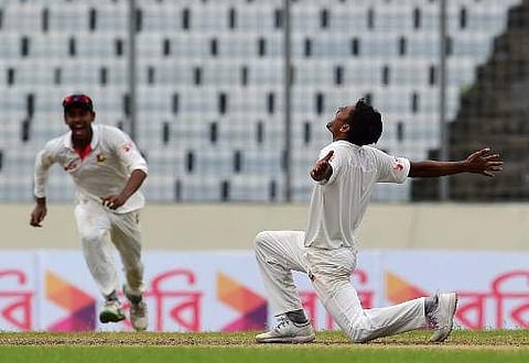 Taijul Islam's (R) happiness knows no bounds after claiming the wicket of Josh Hazlewood- the last of Australian innings. (Photo | AFP)