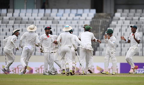 Bangladeshi players celebrate their victory against Australia during the fourth day of their first Test (AP)