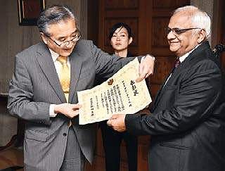 Narayan Kumar being presented with the certificate of honour by Japanese Consul General Seji Baba in the city on Tuesday | Ashwin prasath